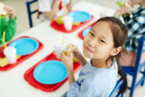 preschool girl eating lunch