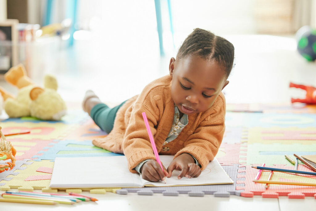 preschooler working on a writing activity.